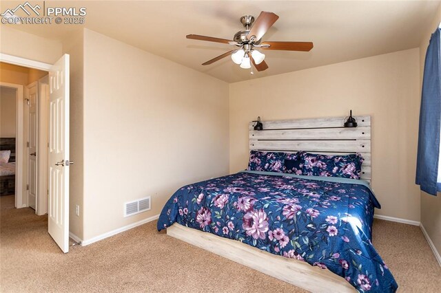 bedroom with carpet flooring, baseboards, and a ceiling fan