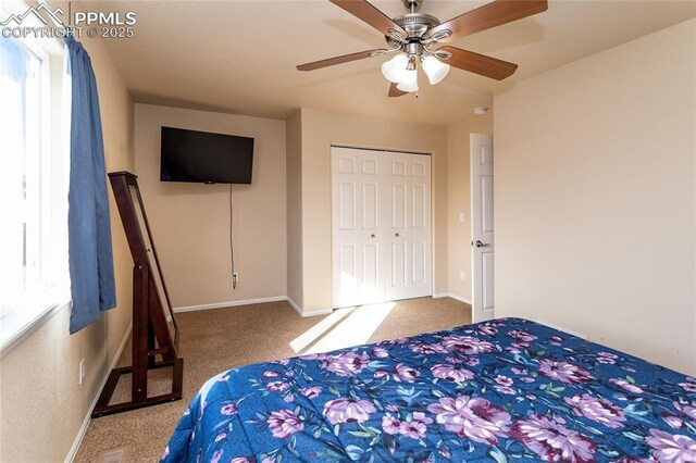 bedroom featuring carpet flooring, baseboards, a closet, and a ceiling fan