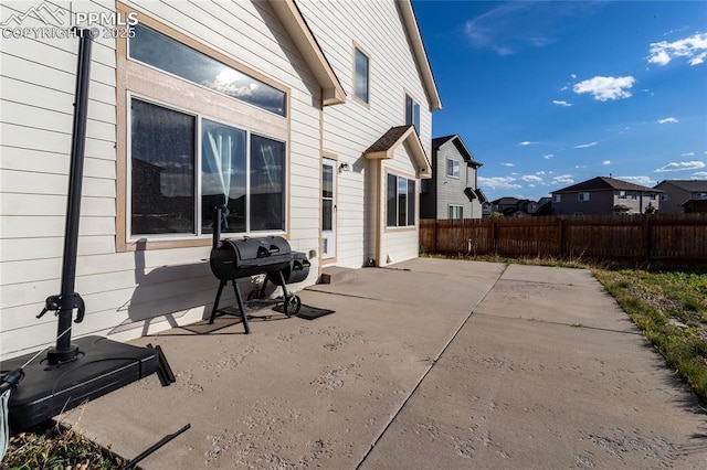 view of patio / terrace with fence and grilling area