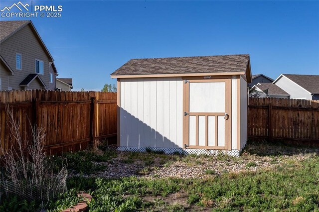 view of shed featuring a fenced backyard
