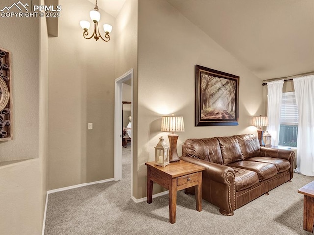 carpeted living room with a chandelier, high vaulted ceiling, and baseboards