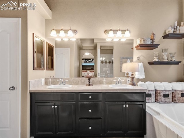 full bath featuring double vanity and a relaxing tiled tub