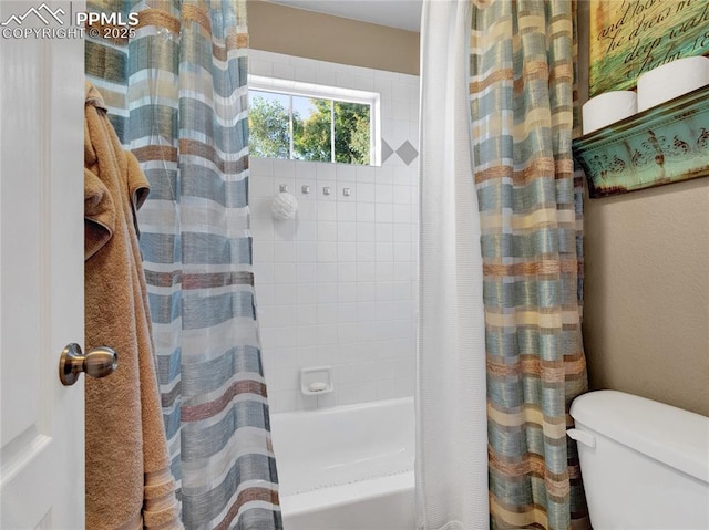 full bath featuring shower / tub combo and toilet