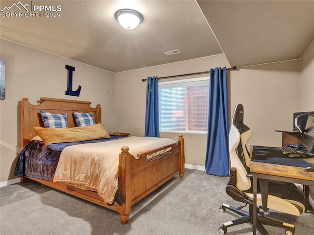 bedroom featuring light carpet, baseboards, and an office area