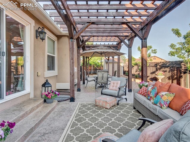 view of patio featuring outdoor lounge area, a fenced backyard, a storage shed, a pergola, and an outbuilding