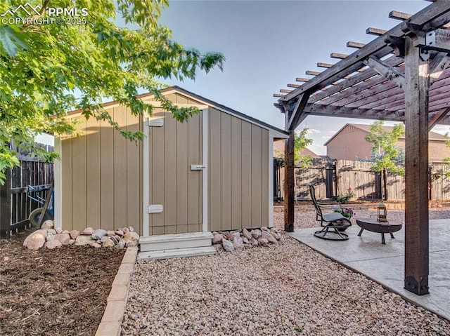 view of shed with a fenced backyard and a pergola