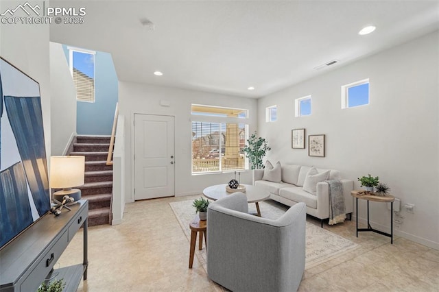 living area featuring stairway, recessed lighting, baseboards, and light flooring