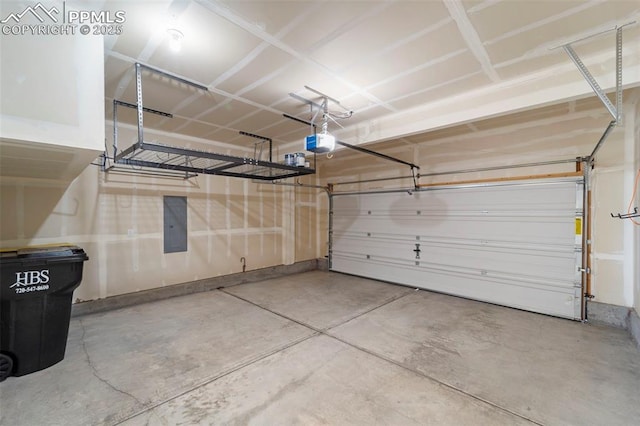 garage featuring a garage door opener and electric panel