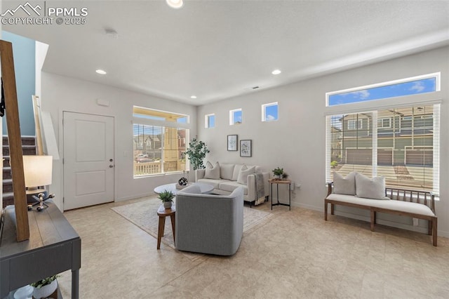 living area with recessed lighting and baseboards
