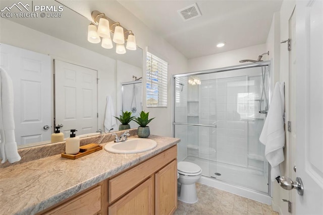 full bath with toilet, a shower stall, vanity, and tile patterned flooring