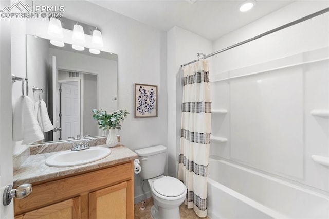 bathroom with toilet, vanity, shower / bath combo, and baseboards