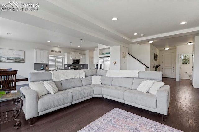 living area featuring dark wood-type flooring, recessed lighting, and baseboards