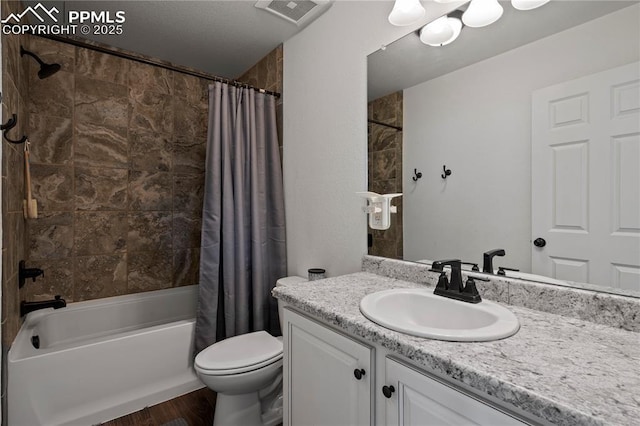full bathroom with vanity, shower / tub combo with curtain, toilet, and wood finished floors