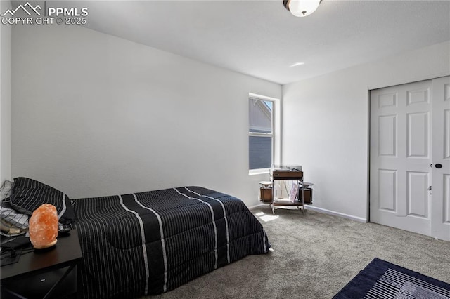 carpeted bedroom featuring baseboards