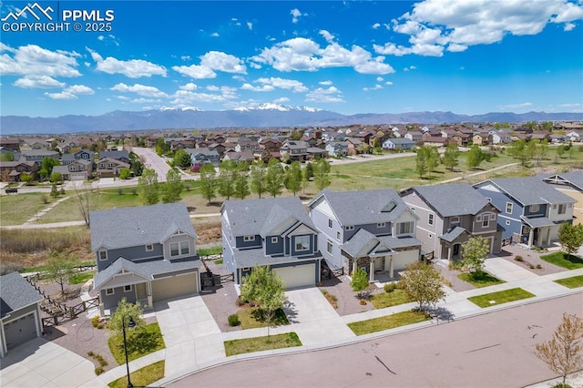 aerial perspective of suburban area featuring a mountain backdrop