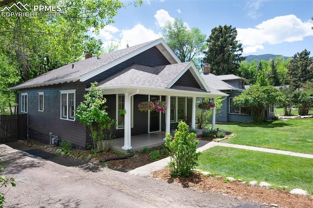 1505 Cheyenne Blvd, Colorado Springs, CO 80906 - view of front facade with a chimney and roof with shingles
