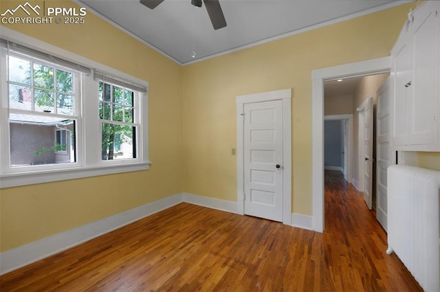 1505 Cheyenne Blvd, Colorado Springs, CO 80906 - unfurnished room with radiator, wood finished floors, ceiling fan, baseboards, and ornamental molding