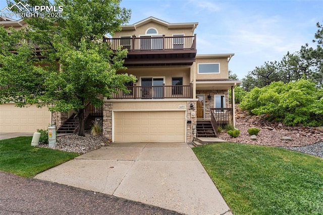 1433 Ledge Rock Ter, Colorado Springs, CO 80919 - view of front facade with stairs, stone siding, stucco siding, driveway, and a balcony