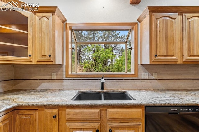 1433 Ledge Rock Ter, Colorado Springs, CO 80919 - kitchen with dishwasher, a sink, decorative backsplash, and light stone counters