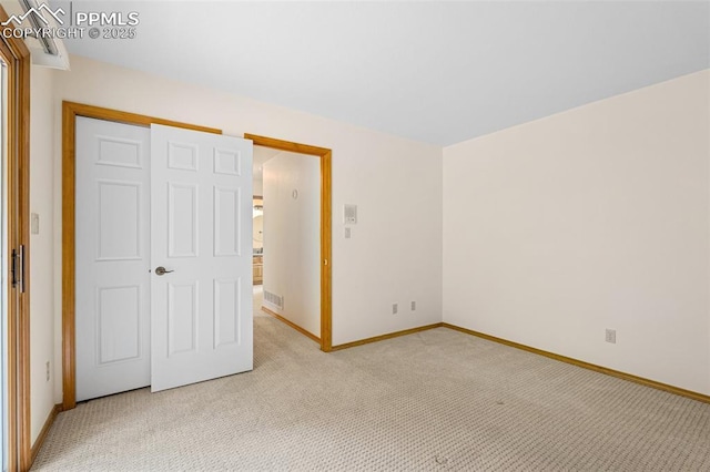 1433 Ledge Rock Ter, Colorado Springs, CO 80919 - unfurnished bedroom featuring light carpet, baseboards, and a closet