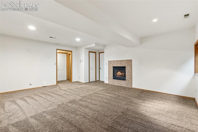 1433 Ledge Rock Ter, Colorado Springs, CO 80919 - unfurnished living room featuring carpet flooring, baseboards, recessed lighting, and a tiled fireplace