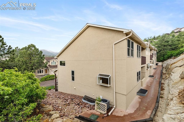 1433 Ledge Rock Ter, Colorado Springs, CO 80919 - view of home's exterior with stucco siding and ac unit