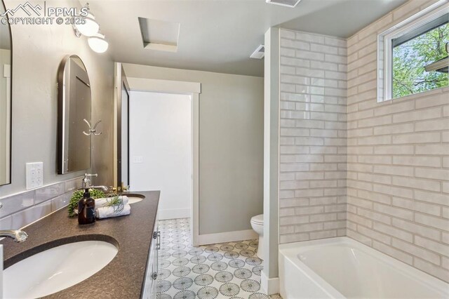 825 N Wahsatch Ave, Colorado Springs, CO 80903 - full bathroom with toilet, baseboards, and double vanity