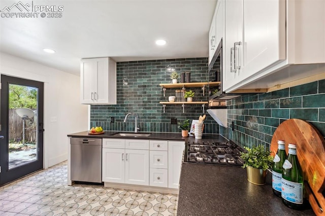 825 N Wahsatch Ave, Colorado Springs, CO 80903 - kitchen featuring stainless steel appliances, a sink, white cabinets, dark countertops, and tasteful backsplash