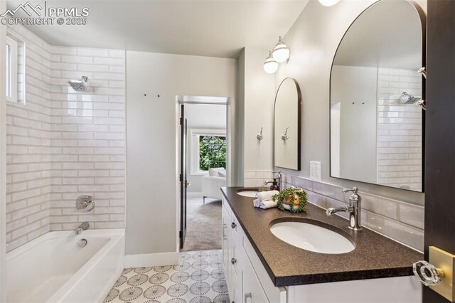 825 N Wahsatch Ave, Colorado Springs, CO 80903 - bathroom with double vanity,  shower combination, tile patterned flooring, and baseboards