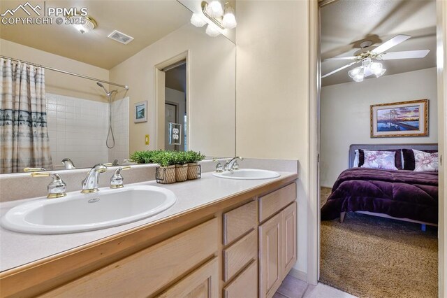 8005 Hedgewood Way, Colorado Springs, CO 80919 - full bathroom featuring double vanity, a ceiling fan, a shower with curtain, and tile patterned floors