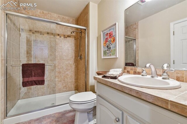 8005 Hedgewood Way, Colorado Springs, CO 80919 - full bathroom with a stall shower, toilet, and vanity