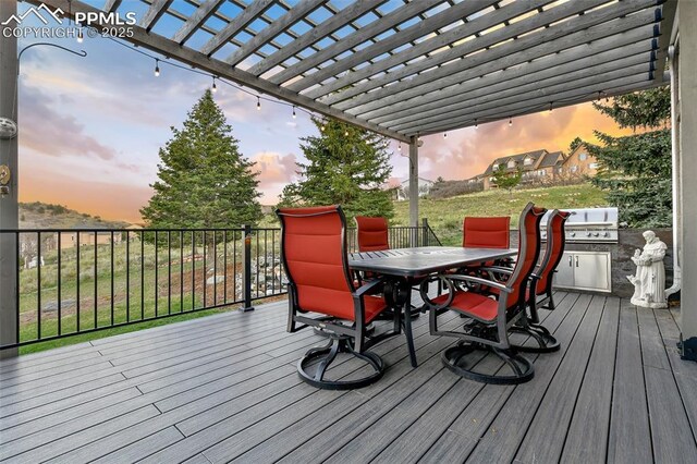 8005 Hedgewood Way, Colorado Springs, CO 80919 - deck at dusk with outdoor dining space and a pergola