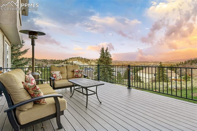 8005 Hedgewood Way, Colorado Springs, CO 80919 - deck at dusk with an outdoor hangout area