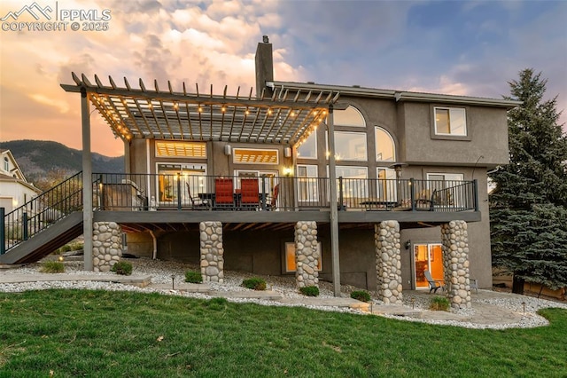 8005 Hedgewood Way, Colorado Springs, CO 80919 - rear view of house featuring a pergola, a yard, stairway, and a wooden deck