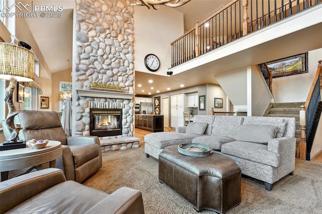 8005 Hedgewood Way, Colorado Springs, CO 80919 - living room with a high ceiling, stairs, a fireplace, recessed lighting, and carpet flooring