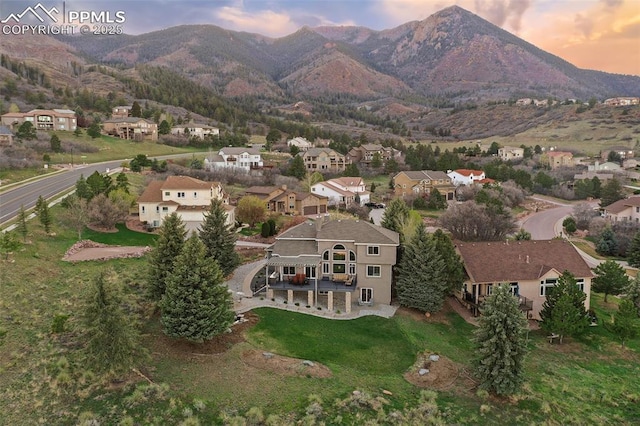8005 Hedgewood Way, Colorado Springs, CO 80919 - aerial view at dusk of a residential view and a mountain view
