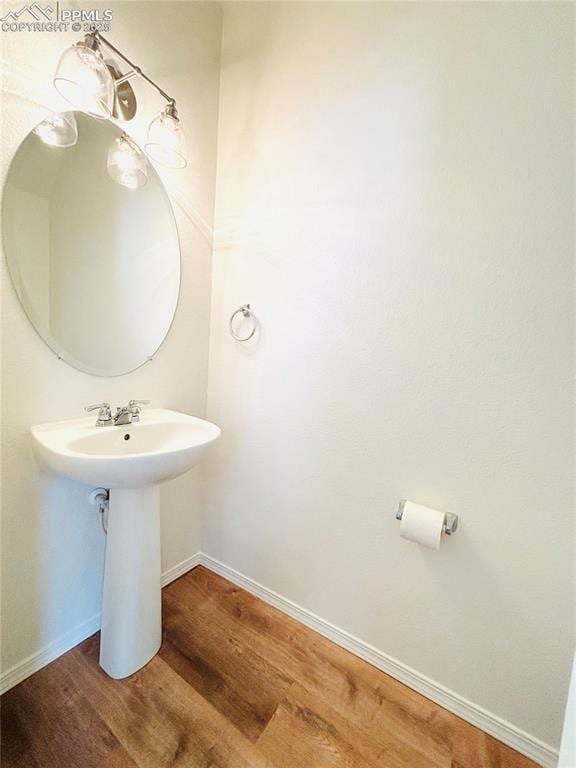 10525 Wells Pt, Fountain, CO 80817 - bathroom with wood finished floors and baseboards