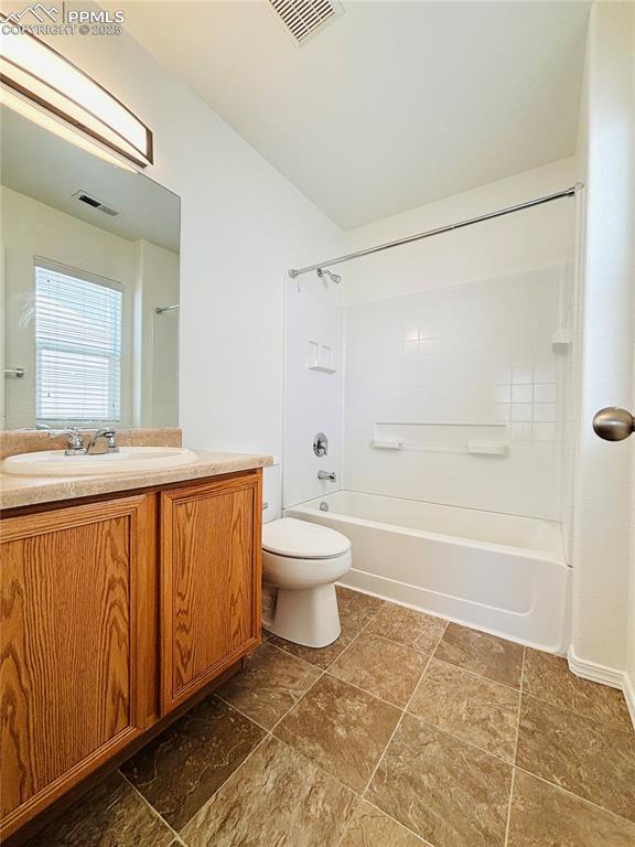 10525 Wells Pt, Fountain, CO 80817 - full bath with toilet, vanity, and tub / shower combination