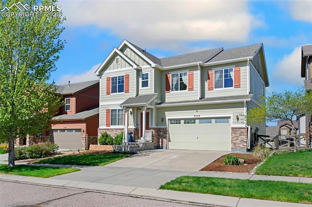 craftsman house with an attached garage, board and batten siding, concrete driveway, and fence