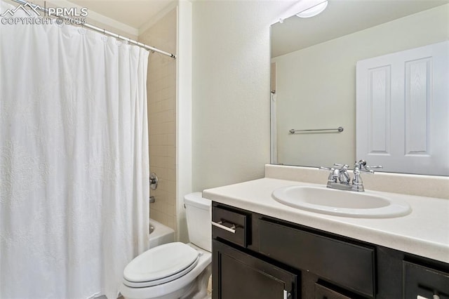 bathroom featuring toilet, vanity, and shower / bath combo