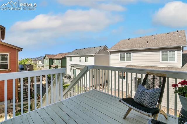 wooden terrace with a residential view