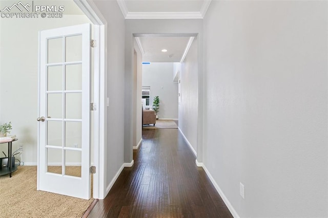 hall featuring ornamental molding, wood-type flooring, baseboards, and recessed lighting