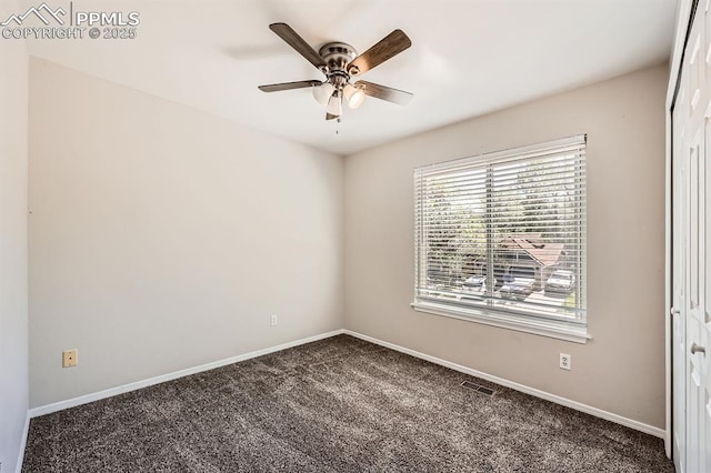 2068 Silkwood Dr, Colorado Springs, CO 80920 - spare room featuring a ceiling fan, dark colored carpet, and baseboards
