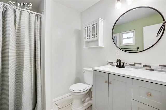 bathroom with toilet, tile patterned flooring, vanity, baseboards, and a shower with curtain