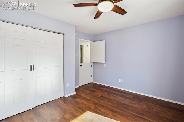 unfurnished bedroom featuring baseboards, wood finished floors, a closet, and ceiling fan