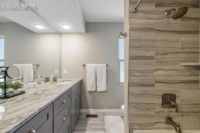 6940 Franciville Rd, Colorado Springs, CO 80908 - bathroom with vanity, a shower, baseboards, and toilet