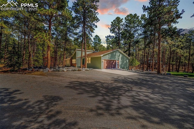 6940 Franciville Rd, Colorado Springs, CO 80908 - view of front of property featuring driveway and an attached garage