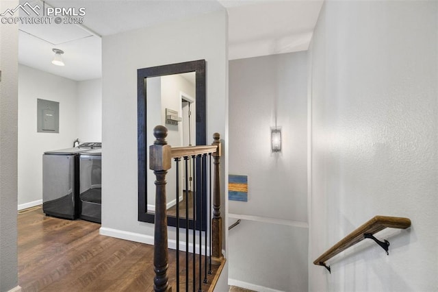 6940 Franciville Rd, Colorado Springs, CO 80908 - stairs featuring washing machine and clothes dryer, electric panel, wood finished floors, and baseboards