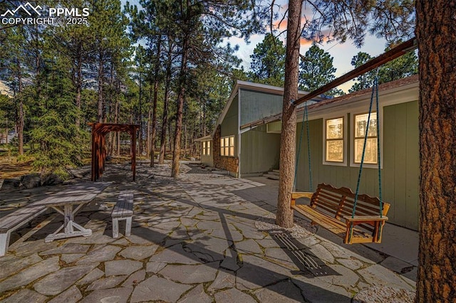 6940 Franciville Rd, Colorado Springs, CO 80908 - patio terrace at dusk with a patio area