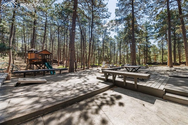 6940 Franciville Rd, Colorado Springs, CO 80908 - wooden deck featuring a playground